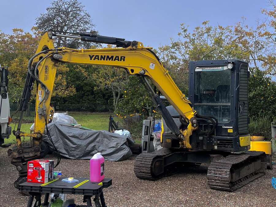 Yanmar excavator detailed on site, paint and glass clean